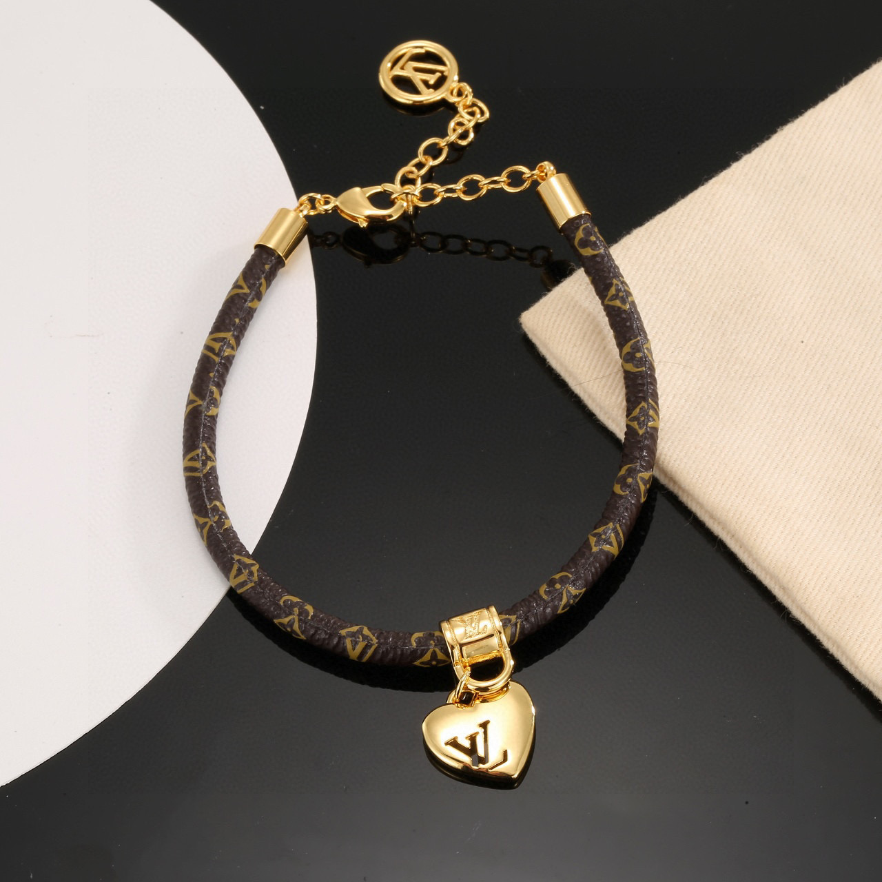 p55 LV Circle Reversible String Bracelet in Signature Monogram Canvas and Gold Metal Tree